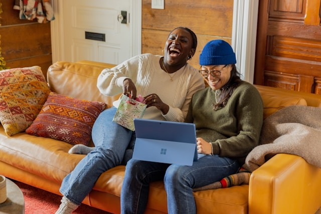 Person with laptop on couch